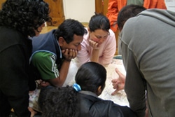 Participants review a topographical map to understand the connection between land use and water quality.
