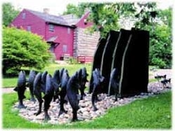 Jeffrey Funk’s bronze and slate “Stream Language” sculpture greets visitors in the Stroud Center’s courtyard.