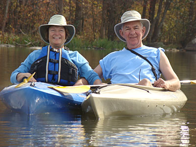 Rich Shockey and his wife in kayaks on the water.