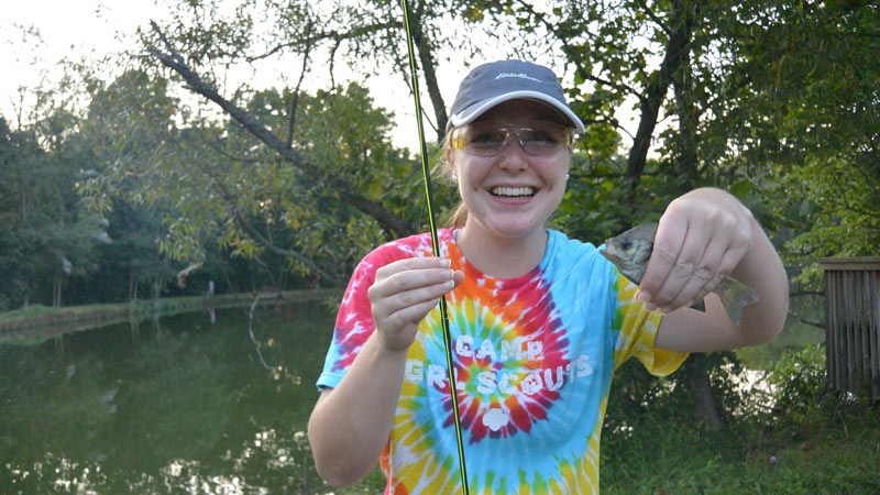 STREAM Girl with her catch -- a bluegill.