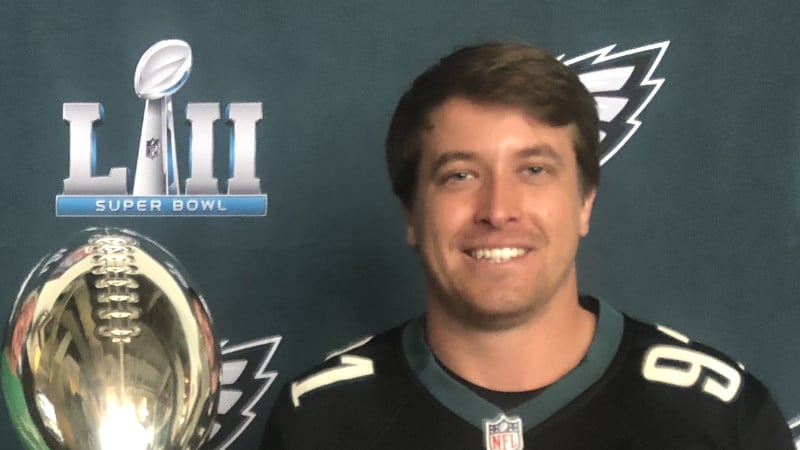Wills Curley in a Philadelphia Eagles jersey with the Super Bowl LII trophy.