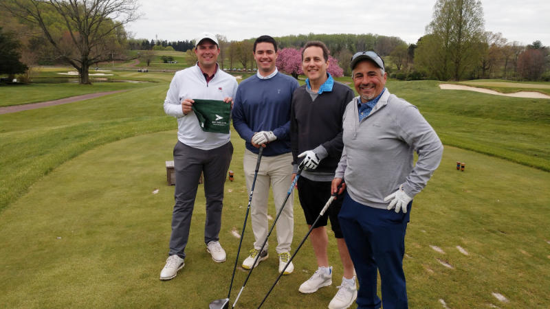 Four golfers from BNY Mellon at the 2022 Fore Fresh Water golf outing.