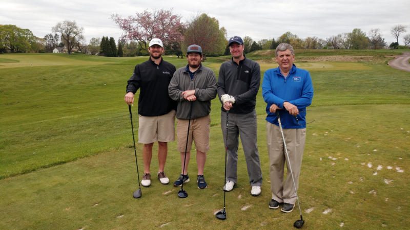 Four golfers from First Resource Bank.