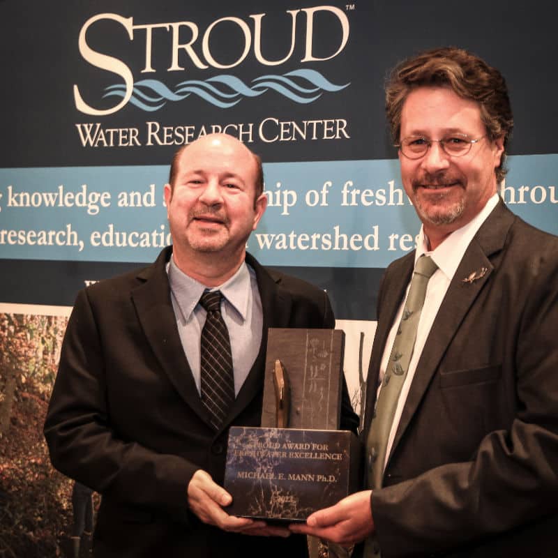 Michael E. Mann receives the 2022 Stroud Award for Freshwater Excellence from David Arscott.