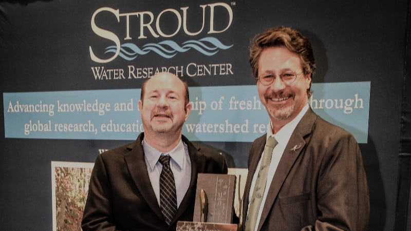 Michael Mann receives 2022 Stroud Award for Freshwater Excellence from Executive Director David Arscott.