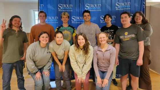 The 2023 interns pose in front of a Stroud Center backdrop.