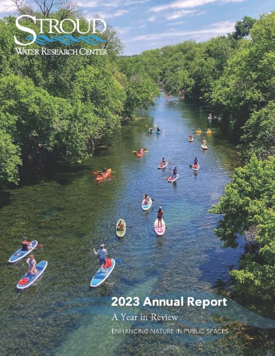 2023 Annual Report showing paddleboarders on Barton Creek in Austin, Texas.