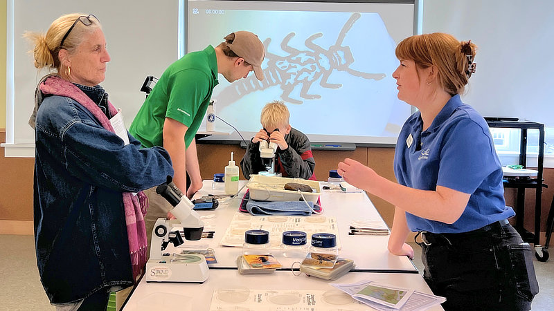 A scientist talks about macroinvertebrates at World Water Day.