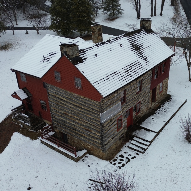 An aerial view of the Stroud Center cabin with a dusting of snow.