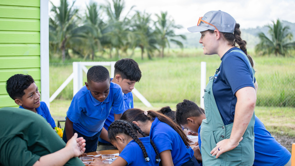 A Stroud Center scientists teaches Belizean children about macroinvertebrates.