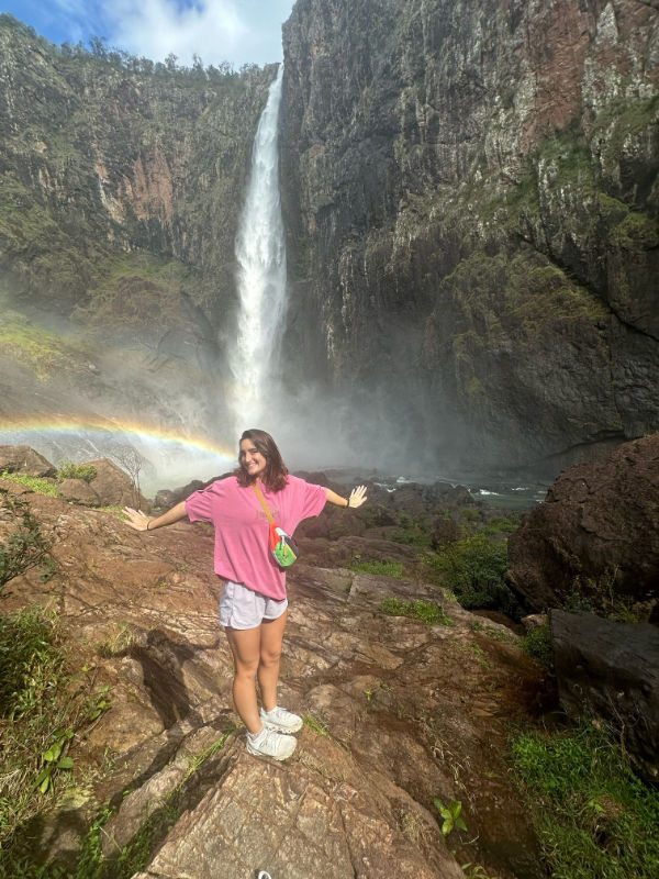 Charlotte Horn near a waterfall.