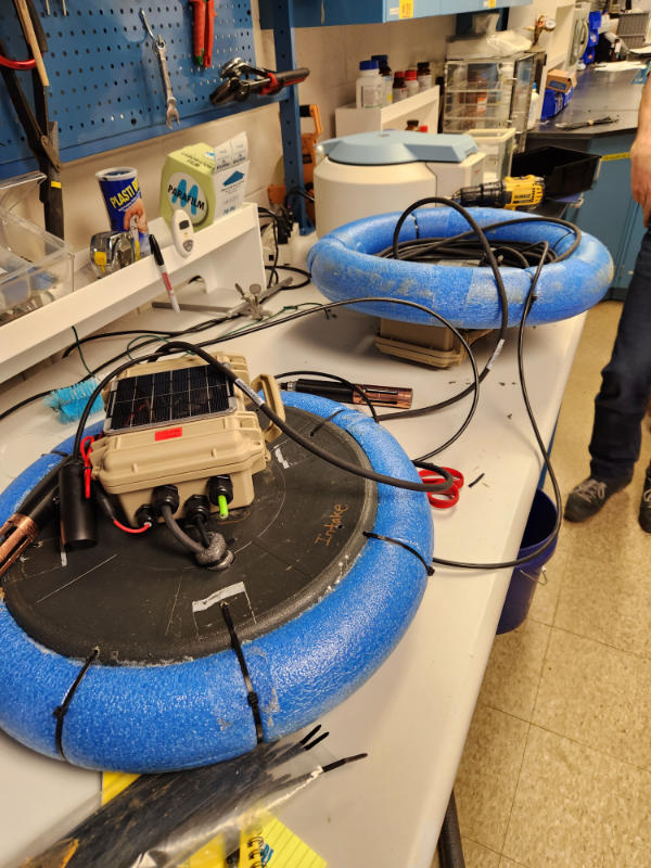 Constructing floating monitoring stations in a Stroud Center labs.