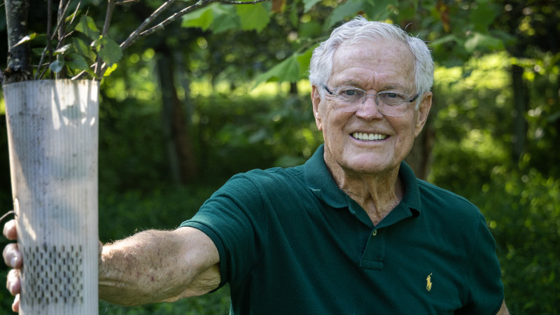 Dick Vermeil with a tree shelter.