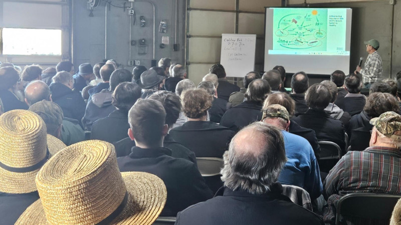 Lamonte Garber, watershed restoration coordinator, speaks to farmers.