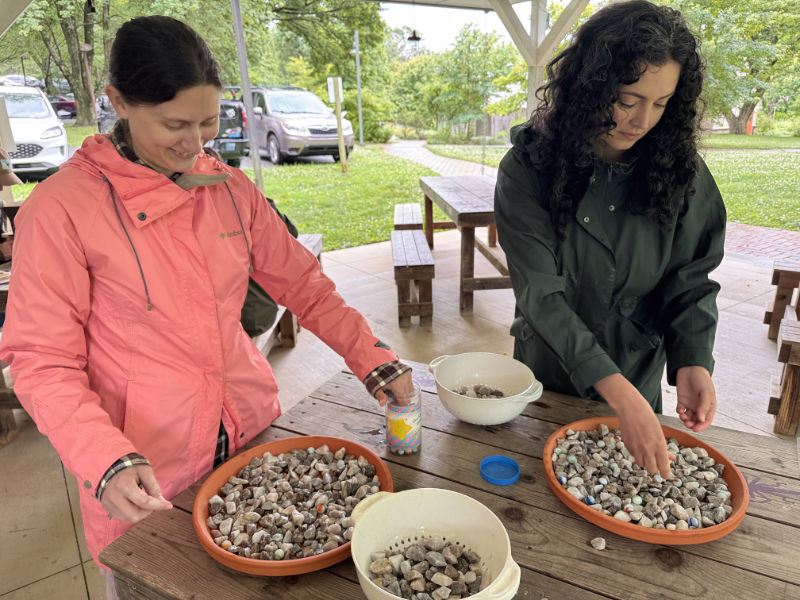 Teachers make insect puddling stations during a workshop.