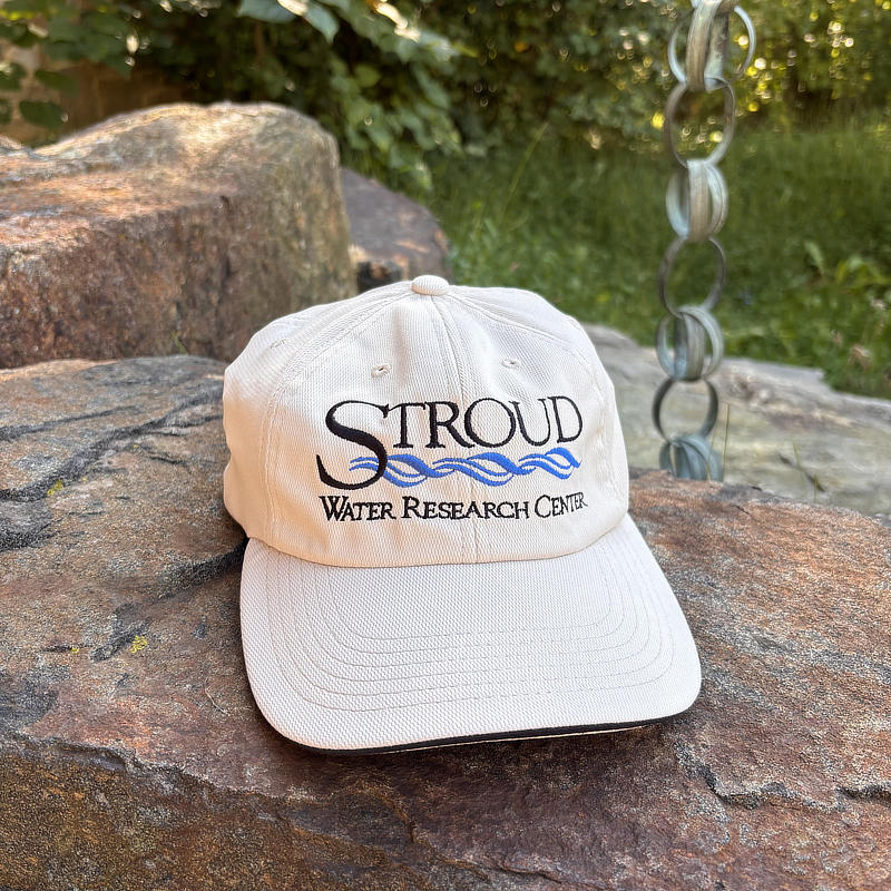 Front view of the light tan Stroud Center ball cap.