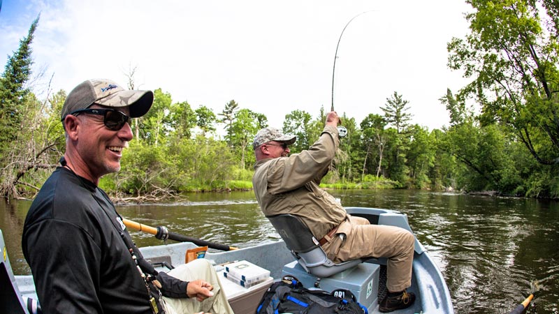 Photo of fishing guide Ed McCoy and a client on the Manistee River, Michigan.