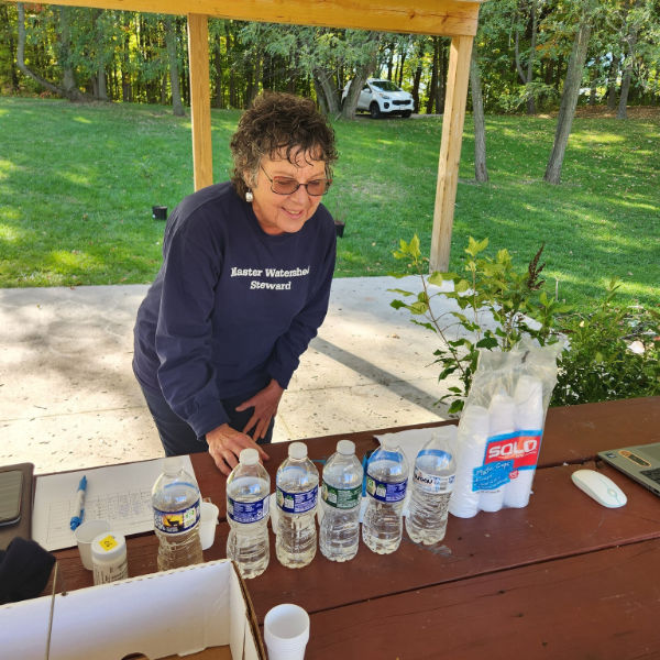 A Master Watershed Steward in northwest Pennsylvania tests her water samples for chloride and conductivity levels.