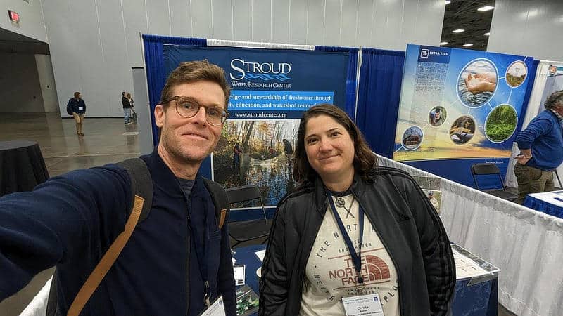 David Bressler and Christa Reeves in front of the Stroud Center exhibit booth.
