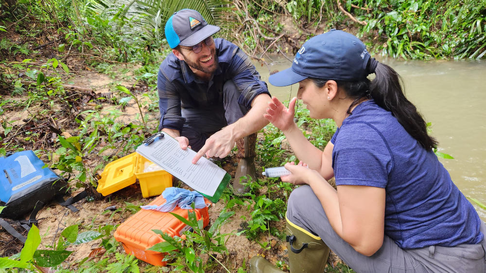Marc Peipoch and Diana Oviedo Vargas sampling a tropical stream.