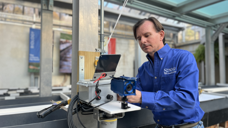 Scott Ensign with Open-Source River Camera and Altimetry (ORCA) for measuring river flooding.