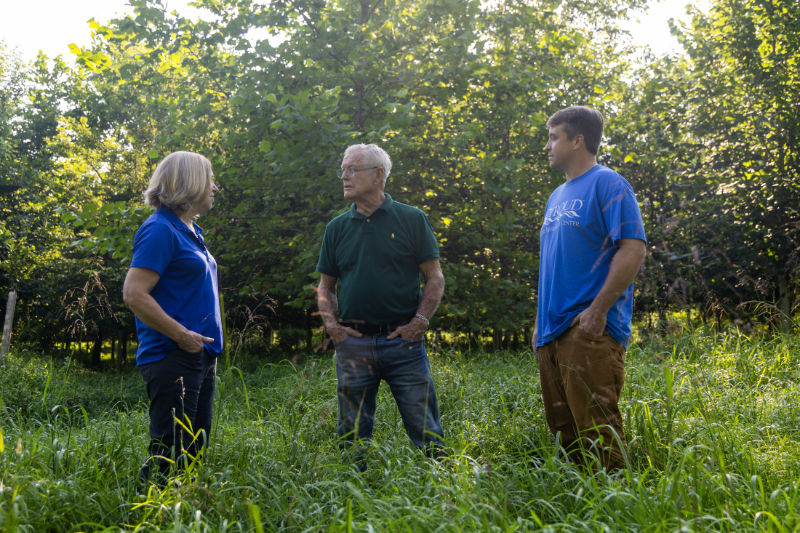 Stroud Center staff chat with Coach Vermeil in his streamside forest.