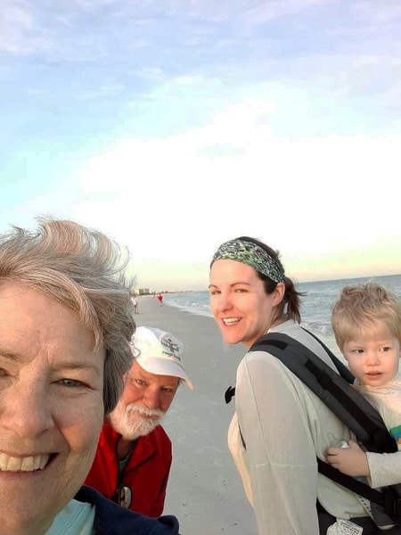 Betsy Kerlin with her family on the beach.