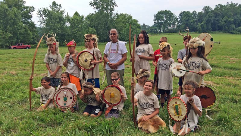 Photo of day campers with Native American elder, Chief Quiet Thunder.