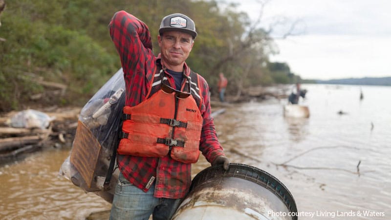 Photo of Chad Pregracke cleaning up a river