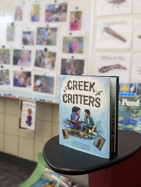 A copy of the Creek Critters book in a classroom.