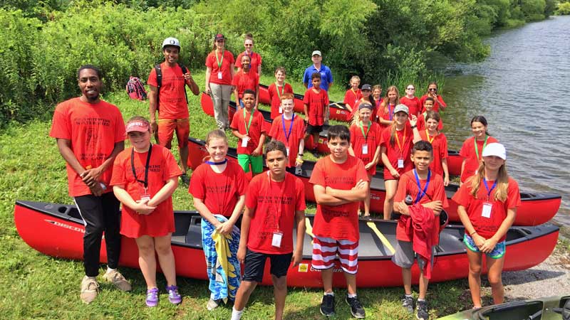 Coatesville Youth Initiative campers with canoes