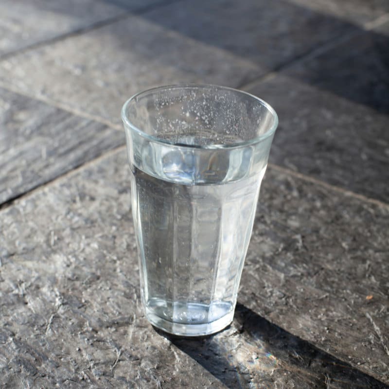 A glass of drinking water.