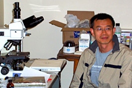Jinjun Kan at work in the laboratory with the tools of his trade.