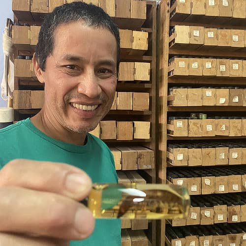 Rafa Morales showing insect specimens collected in streams draining Mount Orosí, Costa Rica. 