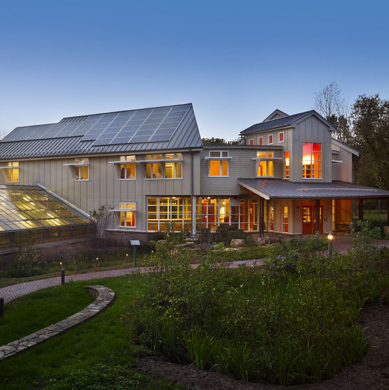The exterior of the Moorhead Environmental Complex at dusk.