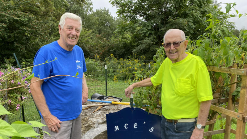 Max Stoner and Don Ace in the community garden at their retirement community.