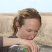 Stephanie Dix pouring a water sample.