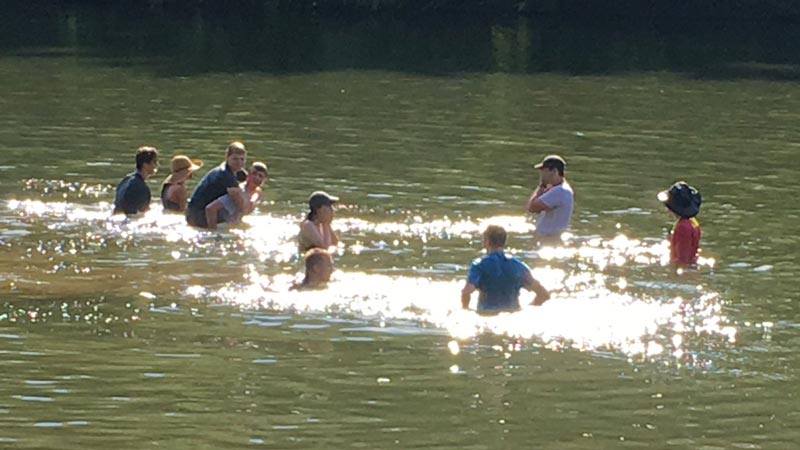 Teenagers swimming in the Schuylkill River