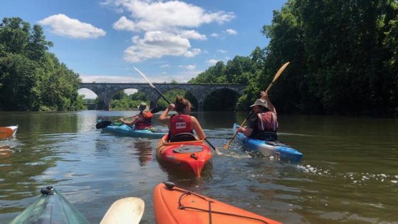 Photo of three kayakers on the Schuylkill River.