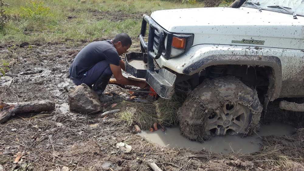 Truck stuck in deep mud in Costa Rica.